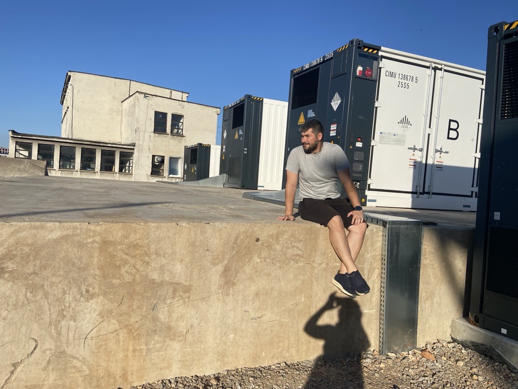 VoltMage team member assessing the battery containers at the Kostinbrod BESS site
